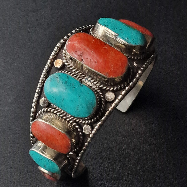 A Tibetan Antique Open Cuff Turquoise and Coral Cabochons