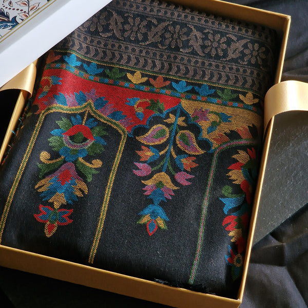 Decorative fabric with intricate patterns in a gold box