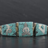 Handmade Tibetan mantra turquoise statement bracelet with detailed silverworkBracelets